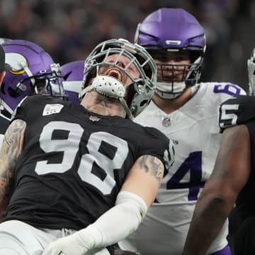 Dec 10, 2023; Paradise, Nevada, USA; Las Vegas Raiders defensive end Maxx Crosby (98) celebrates after a tackle against the Minnesota Vikings in the first half at Allegiant Stadium. Mandatory Credit: Kirby Lee-USA TODAY Sports