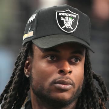 Dec 2, 2022; Las Vegas, NV, USA; Las Vegas Raiders receiver Davante Adams watches from the sidelines during the Pac-12 Championship at Allegiant Stadium. Mandatory Credit: Kirby Lee-USA TODAY Sports