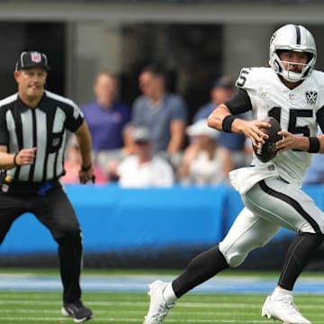 Sep 8, 2024; Inglewood, California, USA; Las Vegas Raiders quarterback Gardner Minshew (15) runs with the ball against the Los Angeles Chargers in the second half at SoFi Stadium. Mandatory Credit: Kirby Lee-Imagn Images