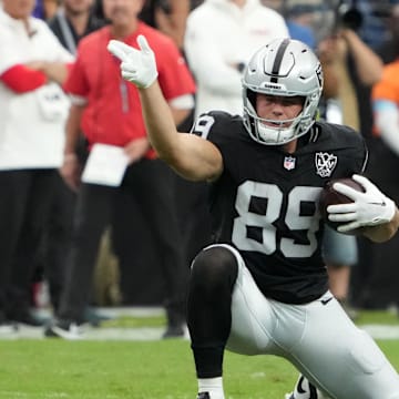 Oct 27, 2024; Paradise, Nevada, USA; Las Vegas Raiders tight end Brock Bowers (89) gestures after a first down against Kansas City Chiefs safety Nazeeh Johnson (13) in the first half at Allegiant Stadium. Mandatory Credit: Kirby Lee-Imagn Images