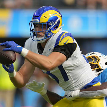 Aug 17, 2024; Inglewood, California, USA; Los Angeles Rams tight end Davis Allen (87) catches the ball against Los Angeles Chargers safety AJ Finley (24) in the first half at SoFi Stadium. Mandatory Credit: Kirby Lee-Imagn Images