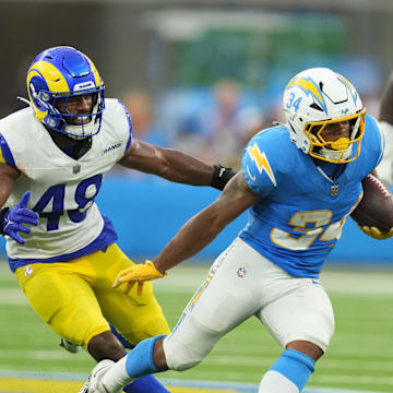 Aug 17, 2024; Inglewood, California, USA; Los Angeles Chargers running back Jaret Patterson (34) carries the ball against Los Angeles Rams in the second half at SoFi Stadium. Mandatory Credit: Kirby Lee-Imagn Images