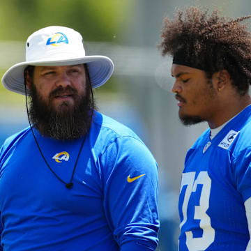 May 21, 2024, Thousand Oaks, California, USA; Los Angeles Rams offensive line coach Ryan Wendell (left) and lineman Steve Avila (73) during organized team activities at Cal Lutheran University. Mandatory Credit: Kirby Lee-Imagn Images