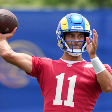 Jun 3, 2025; Woodland Hills, CA, USA; Los Angeles Rams quarterback Jimmy Garoppolo (11) throws the ball during organized team activities at Rams Practice Facility. Mandatory Credit: Kirby Lee-Imagn Images