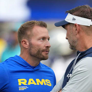 Aug 9, 2025; Inglewood, California, USA; Los Angeles Rams Sean McVay (left) talks with Dallas Cowboys coach Brian Schottenheimer during the game at SoFi Stadium. Mandatory Credit: Kirby Lee-Imagn Images