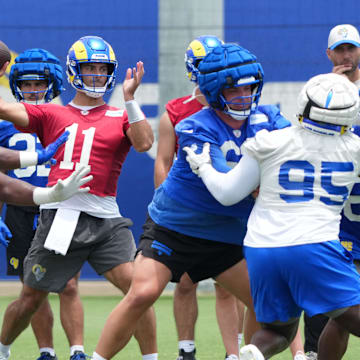 Jun 3, 2025; Woodland Hills, CA, USA; Los Angeles Rams quarterback Jimmy Garoppolo (11) throws the ball during organized team activities at Rams Practice Facility. Mandatory Credit: Kirby Lee-Imagn Images