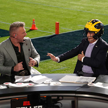 Jan 1, 2024; Pasadena, CA, USA; Pat McAfee (left), Lee Corso (center) and Kirk Herbstreit on the ESPN College Gameday set at the 2024 Rose Bowl college football playoff semifinal game at Rose Bowl. Mandatory Credit: Kirby Lee-Imagn Images