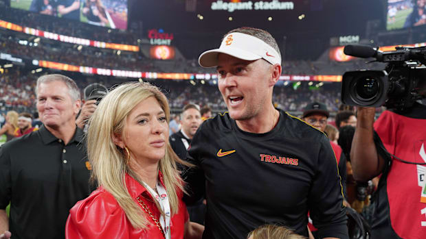 Southern California Trojans head coach Lincoln Riley with wife Caitlin Riley after the game against the LSU Tigers 