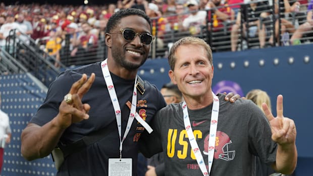 Sep 1, 2024; Paradise, Nevada, USA; Southern California Trojans running back Reggie Bush (left) and basketball coach Eric Mus