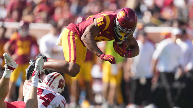 ; Southern California Trojans wide receiver Kyle Ford (81) carries the ball ball against Wisconsin Badgers safety Hunter Wohl