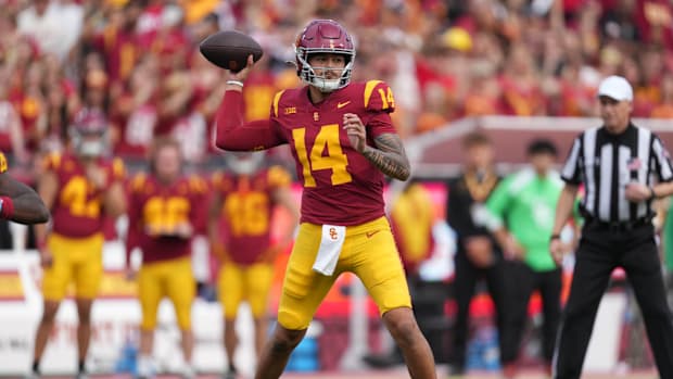 Nov 30, 2024; Los Angeles, California, USA; Southern California Trojans quarterback Jayden Maiava (14) throws the ball agains