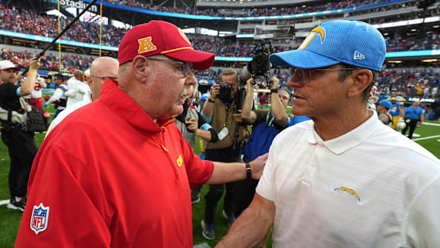 Kansas City Chiefs coach Andy Reid shakes hands with Los Angeles Chargers coach Jim Harbaugh in 2024