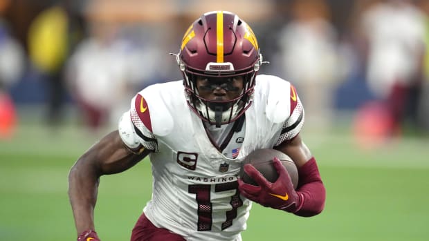 Washington Commanders wide receiver Terry McLaurin (17) carries the ball against the Los Angeles Rams