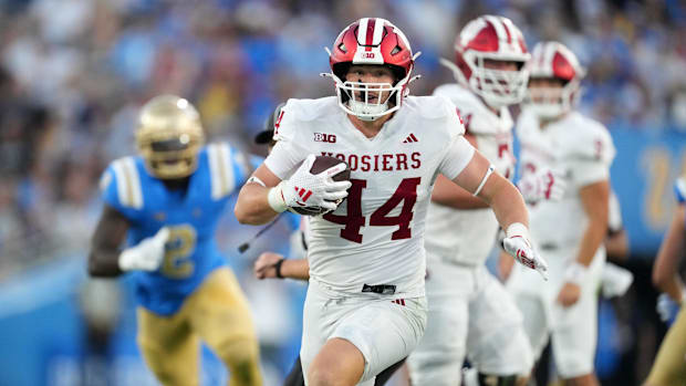 Sep 14, 2024; Pasadena, California, USA; Indiana Hoosiers tight end Zach Horton (44) carries the ball against the UCLA Bruins