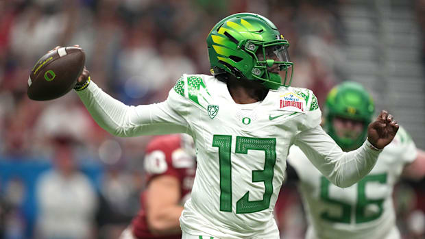 Dec 29, 2021; San Antonio, Texas, USA; Oregon Ducks quarterback Anthony Brown (13) throws the ball against the Oklahoma Soone