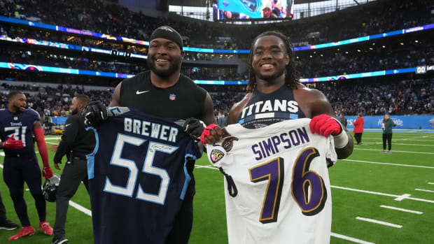 Oct 15, 2023; London, United Kingdom; Baltimore Ravens guard John Simpson (left) and Tennessee
