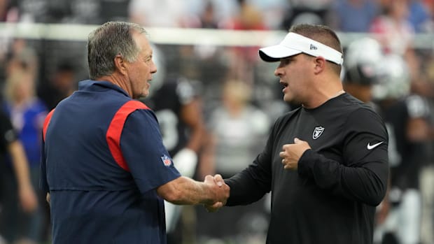 Former NFL coaches Bill Belichick and Josh McDaniels
