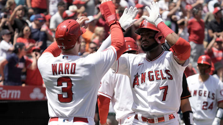 Los Angeles Angels left fielder Jo Adell (7) celebrates with right fielder Taylor Ward (3)