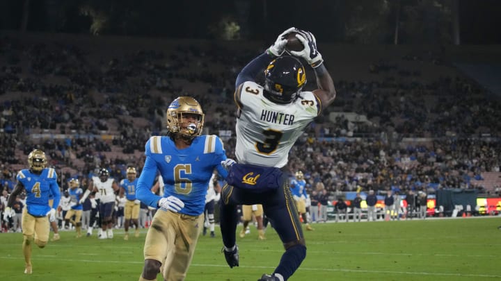 Nov 25, 2023; Pasadena, California, USA; California Golden Bears wide receiver Jeremiah Hunter (3) catches a 13-yard touchdown pass against UCLA Bruins defensive back John Humphrey (6) in the second half at Rose Bowl. Mandatory Credit: Kirby Lee-USA TODAY Sports