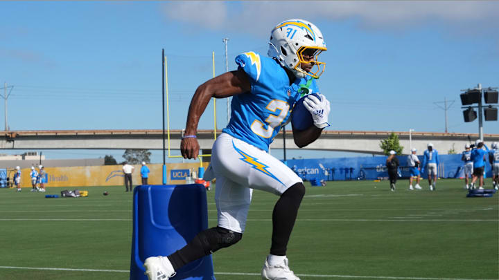 Jul 25, 2025; El Segundo, CA, USA; Los Angeles Chargers running back Trikweze Bridges carries the ball during training camp at The Bolt. Mandatory Credit: Kirby Lee-Imagn Images