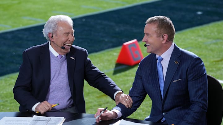 Jan 1, 2024; Pasadena, CA, USA; Lee Corso (left) and Kirk Herbstreit on the ESPN College Gameday set at the 2024 Rose Bowl college football playoff semifinal game at Rose Bowl. Mandatory Credit: Kirby Lee-Imagn Images