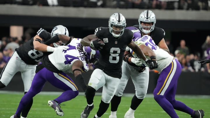Dec 10, 2023; Paradise, Nevada, USA; Las Vegas Raiders running back Josh Jacobs (8) carries the ball against the Minnesota Vikings in the first half at Allegiant Stadium. Mandatory Credit: Kirby Lee-USA TODAY Sports