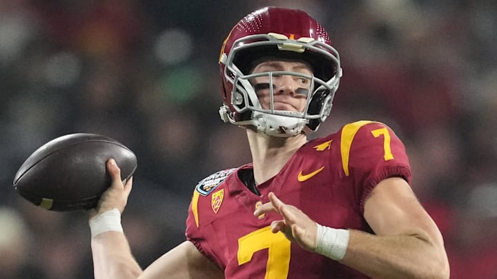 Dec 27, 2023; San Diego, CA, USA; Southern California Trojans quarterback Miller Moss (7) throws the ball against the Louisville Cardinalsin the first half of the Holiday Bowl at Petco Park. Mandatory Credit: Kirby Lee-Imagn Images