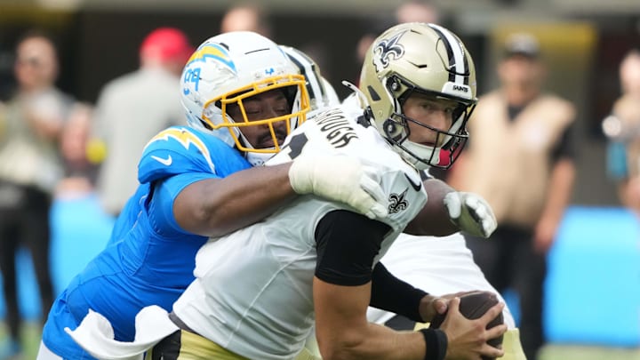 Aug 10, 2025; Inglewood, California, USA; Los Angeles Chargers defensive tackle Jamaree Caldwell (99) sacks New Orleans Saints quarterback Tyler Shough (6) in the second half at SoFi Stadium. Mandatory Credit: Kirby Lee-Imagn Images