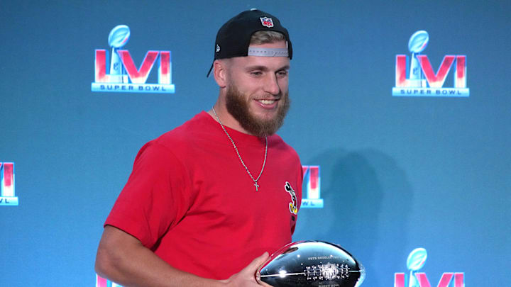 Feb 14, 2022; Los Angeles, CA, USA; Los Angeles Rams receiver Cooper Kupp poses with Super Bowl 56 most valuable player trophy during Super Bowl LVI winning coach and most valuable player press conference at the Los Angeles Convention Center. Mandatory Credit: Kirby Lee-Imagn Images