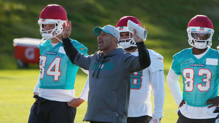 Oct 15, 2021; Ware, United Kingdom; Miami Dolphins special teams coordinator Danny Crossman with wide receiver Kirk Merritt (83) and  tight end Hunter Long (84 during practice at Hanbury Marriott Manor and Country Club. Mandatory Credit: Kirby Lee-USA TODAY Sports