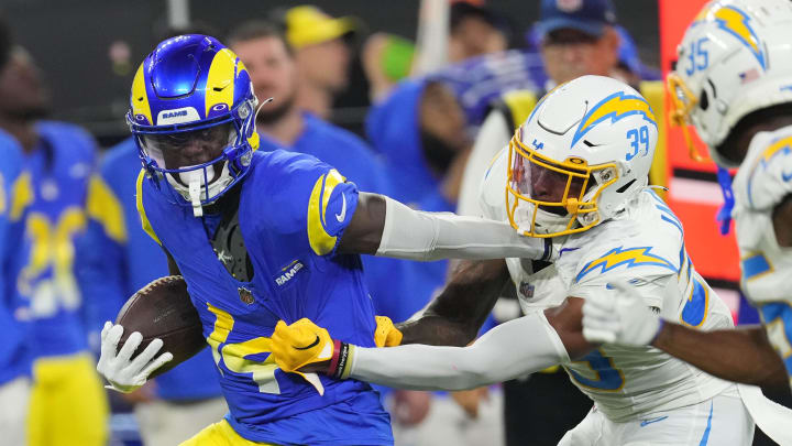 Aug 12, 2023; Inglewood, California, USA; Los Angeles Rams wide receiver Tyler Johnson (14) carries the ball against Los Angeles Chargers cornerback Michael Jacquet (39) at SoFi Stadium. Mandatory Credit: Kirby Lee-USA TODAY Sports