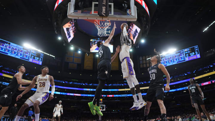 Mar 19, 2023; Los Angeles, California, USA; Orlando Magic center Goga Bitadze (right) blocks a shot by Los Angeles Lakers forward Wenyen Gabriel  in the first half at Crypto.com Arena. Mandatory Credit: Kirby Lee-USA TODAY Sports