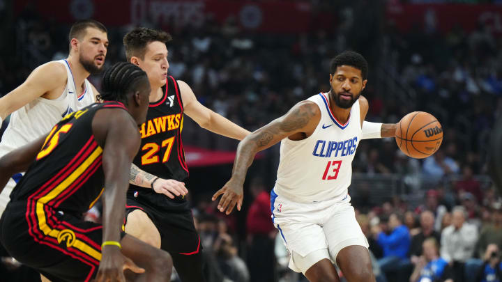 Mar 17, 2024; Los Angeles, California, USA; LA Clippers forward Paul George (13) drives to the basket against Atlanta Hawks guard Vit Krejci (27) in the first half at Crypto.com Arena. Mandatory Credit: Kirby Lee-USA TODAY Sports