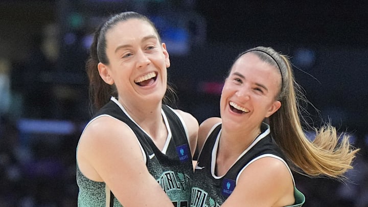 Aug 15, 2024; Los Angeles, California, USA; New York Liberty forward Breanna Stewart (30) and guard Sabrina Ionescu (20) celebrate in the first half against the LA Sparks Crypto.com Arena. Mandatory Credit: Kirby Lee-Imagn Images