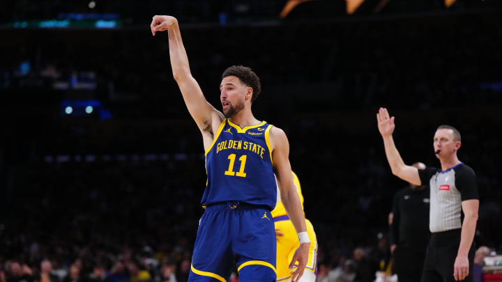 Apr 9, 2024; Los Angeles, California, USA; Golden State Warriors guard Klay Thompson (11) follows through on a three-point shot against the Los Angeles Lakers in the second half at Crypto.com Arena. Mandatory Credit: Kirby Lee-USA TODAY Sports