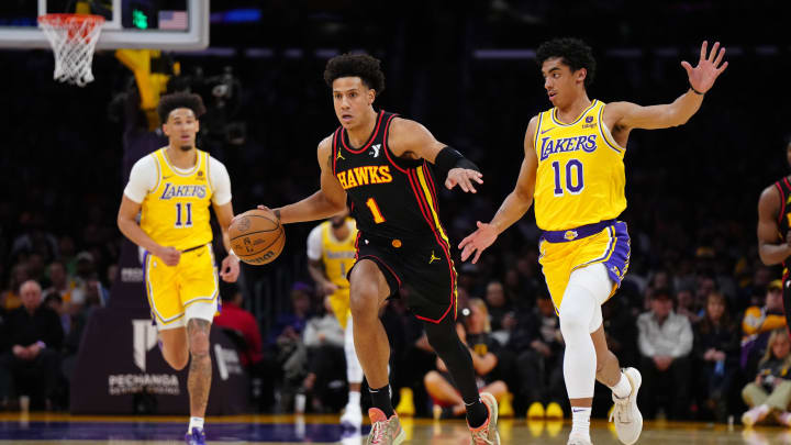 Mar 18, 2024; Los Angeles, California, USA; Atlanta Hawks forward Jalen Johnson (1) dribbles the ball against Los Angeles Lakers guard Max Christie (10) in the first half at Crypto.com Arena. Mandatory Credit: Kirby Lee-USA TODAY Sports