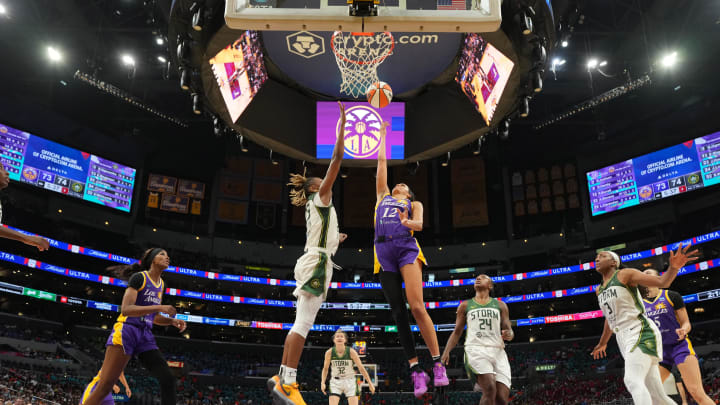 Jul 16, 2024; Los Angeles, California, USA; LA Sparks guard Rae Burrell (12) shoots the ball against Seattle Storm guard Jordan Horston (23) in the first half at Crypto.com Arena. Mandatory Credit: Kirby Lee-USA TODAY Sports