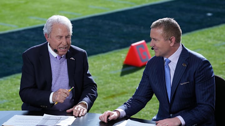 Jan 1, 2024; Pasadena, CA, USA; Lee Corso (left) and Kirk Herbstreit on the ESPN College Gameday set at the 2024 Rose Bowl college football playoff semifinal game at Rose Bowl. Mandatory Credit: Kirby Lee-Imagn Images