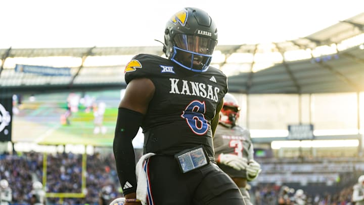 Sep 13, 2024; Kansas City, Kansas, USA; Kansas Jayhawks quarterback Jalon Daniels (6) scores a touchdown during the first half against the UNLV Rebels at Children's Mercy Park. Mandatory Credit: Jay Biggerstaff-Imagn Images