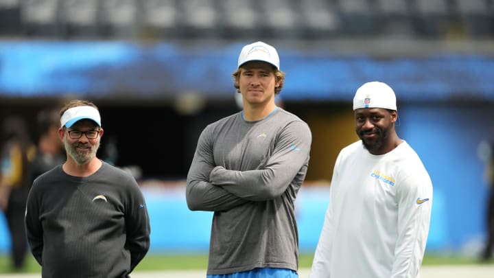 Aug 17, 2024; Inglewood, California, USA; Los Angeles Rams quarterbacks coach Shane Day (left), quarterback Justin Herbert (center) and linebackers coach Navorro Bowman during the game against the Los Angeles Rams at SoFi Stadium. Mandatory Credit: Kirby Lee-USA TODAY Sports