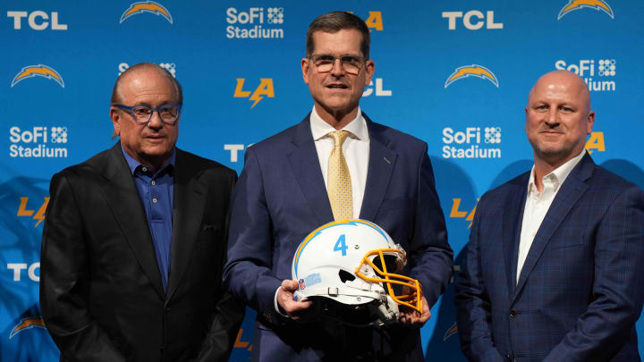 Feb 1, 2024; Inglewood, CA, USA; Los Angeles Chargers owner Dean Spanos (left), coach Jim Harbaugh (center) and general manager Joe Hortiz pose at an introductory press conference at YouTube Theater at SoFi Stadium. Mandatory Credit: Kirby Lee-USA TODAY Sports