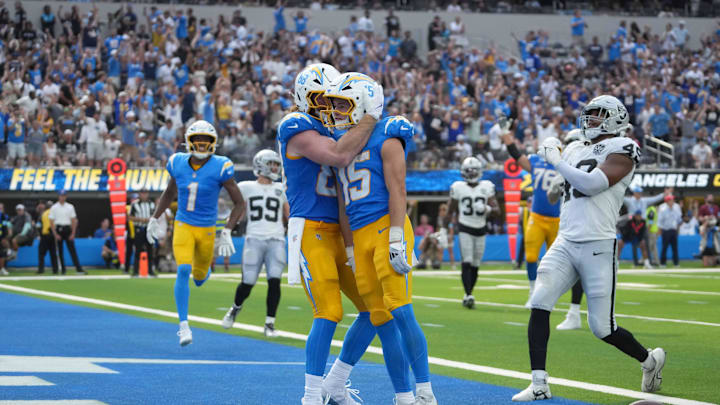 Sep 8, 2024; Inglewood, California, USA; Los Angeles Chargers wide receiver Ladd McConkey (15) celebrates with tight end Hayden Hurst (88) after scoring on a 15-yard touchdown reception against the Los Angeles Chargers in the second half at SoFi Stadium. Mandatory Credit: Kirby Lee-Imagn Images