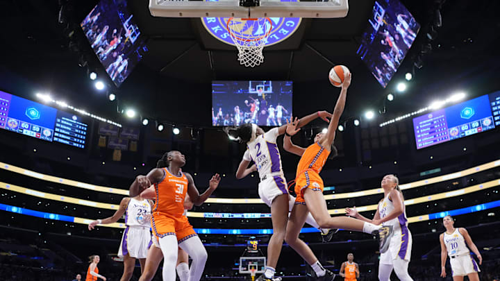 Aug 7, 2025; Los Angeles, California, USA; Connecticut Sun center Olivia Nelson-Ododa (10) shoots the ball against LA Sparks forward Rickea Jackson (2) in the second half at the Crypto.com Arena. 