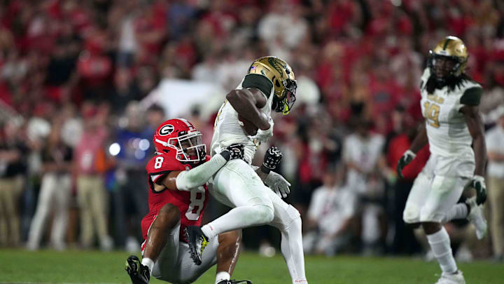 Sep 23, 2023; Athens, Georgia, USA; Georgia Bulldogs defensive back Joenel Aguero (8) tackles UAB Blazers receiver Amere Thomas (17) in the second half at Sanford Stadium. Mandatory Credit: Kirby Lee-Imagn Images