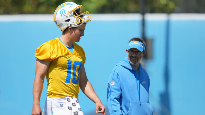 Jun 13, 2024; Costa Mesa, CA, USA; Los Angeles Chargers quarterback Justin Herbert (10) interacts with quarterbacks coach Shane Day during minicamp at the Hoag Performance Center.  Mandatory Credit: Kirby Lee-USA TODAY Sports