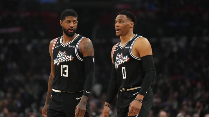 Feb 24, 2023; Los Angeles, California, USA; LA Clippers forward Paul George (13) and guard Russell Westbrook (0) react against the Sacramento Kings in the first half at Crypto.com Arena. Mandatory Credit: Kirby Lee-USA TODAY Sports