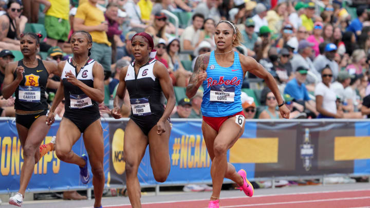 Jun 8, 2024; Eugene, OR, USA; McKenzie Long of Mississippi (right) defeats Jayla Jamison (left) and JaMeesia Ford (center) of South Carolina to win the women's 200m in 21.83 during the NCAA Track and Field Championships at Hayward Field. Mandatory Credit: Kirby Lee-USA TODAY Sports