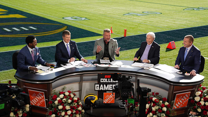 Jan 1, 2024; Pasadena, CA, USA; From left: Desmond Howard, Rece Davis, Pat McAfee, Lee Corso and Kirk Herbstreit on the ESPN College Gameday set at the 2024 Rose Bowl college football playoff semifinal game at Rose Bowl. Mandatory Credit: Kirby Lee-Imagn Images