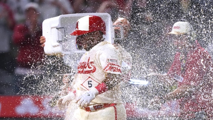 Jul 12, 2024; Anaheim, California, USA; Los Angeles Angels designated hitter Willie Calhoun (5) celebrates with teammates after hitting a two-run walkoff home run in the 10th inning against the Seattle Mariners at Angel Stadium. Mandatory Credit: Kirby Lee-USA TODAY Sports