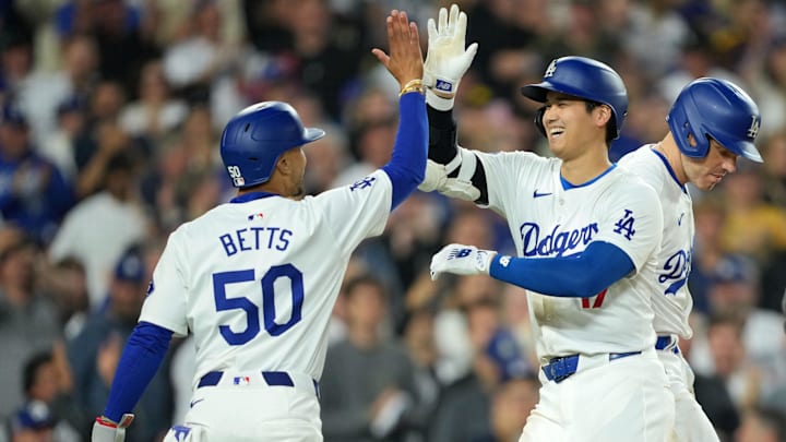 Jun 11, 2024; Los Angeles, California, USA; Los Angeles Dodgers designated hitter Shohei Ohtani (17) celebrates at home plate with shortstop Mookie Betts (50) after hitting a two-run home run in the sixth inning against the Texas Rangers at Dodger Stadium. at Dodger Stadium. Mandatory Credit: Kirby Lee-Imagn Images